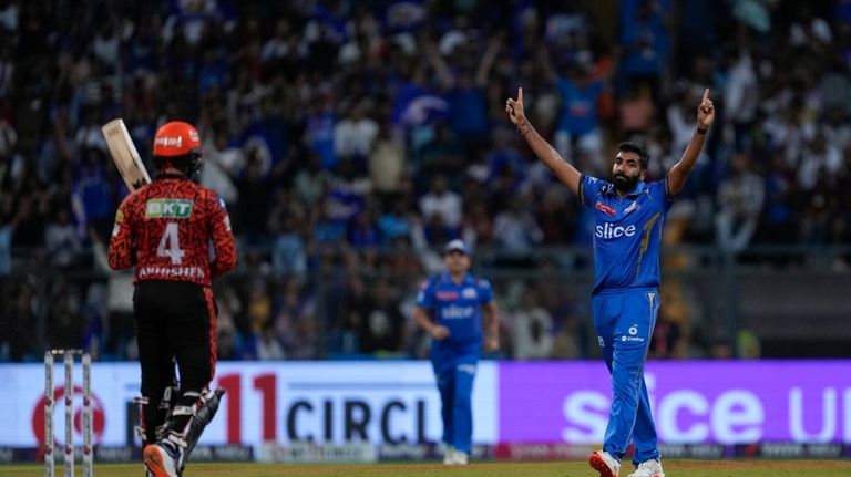 Mumbai Indians' Jasprit Bumrah celebrates the wicket of Sunrisers Hyderabad's...