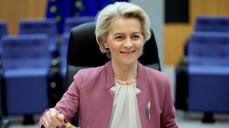 European Commission President Ursula von der Leyen rings a bell...