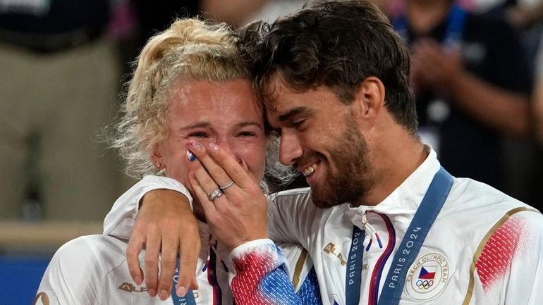 Czech Republic's Tomas Machac and Katerina Siniakova react on the...