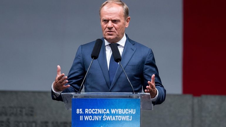 Poland's Prime Minister Donald Tusk attends solemn ceremonies at the...