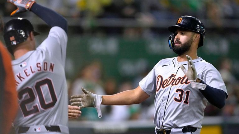 Detroit Tigers' Riley Greene (31) is congratulated by Spencer Torkelson...