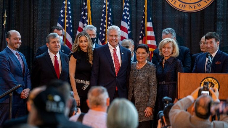 Nassau County Executive Bruce Blakeman, center, with his wife Segal,...