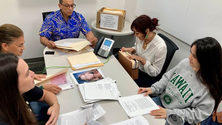 Hawaii Innocence Project co-director Kenneth Lawson, back center, and law...