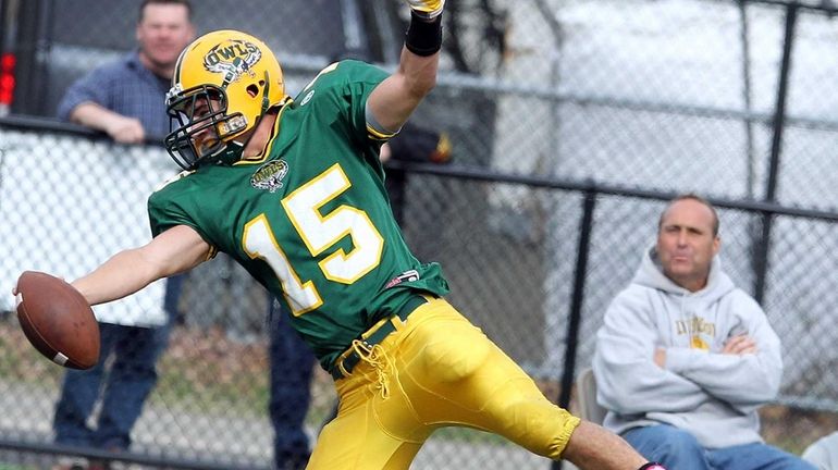 Lynbrook's QB Joe Grossi reaches for the TD after getting...