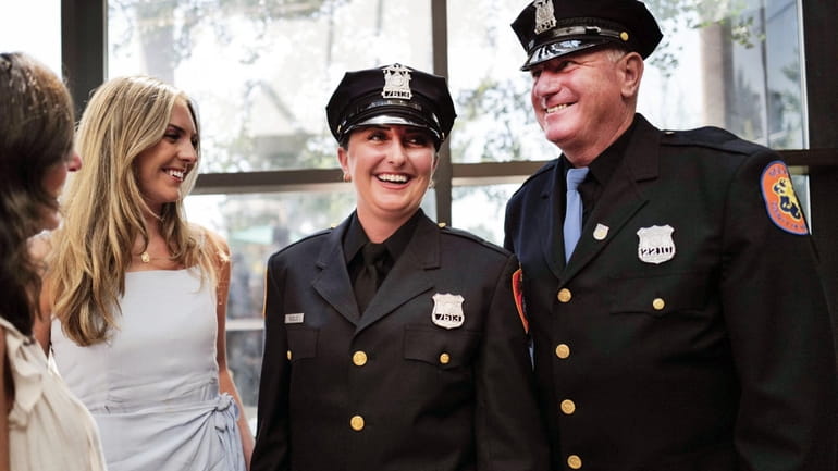 New Suffolk County Police Officer Rebecca Bilello, second from right,...