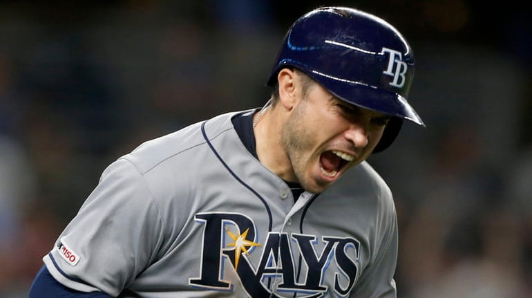 Rays catcher Travis d'Arnaud reacts after his three-run home run in the...