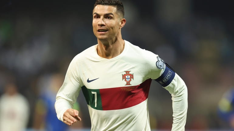 Portugal's Cristiano Ronaldo reacts after scoring during the Euro 2024...