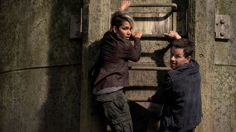 This image released by Netflix shows Halle Berry, left, and...