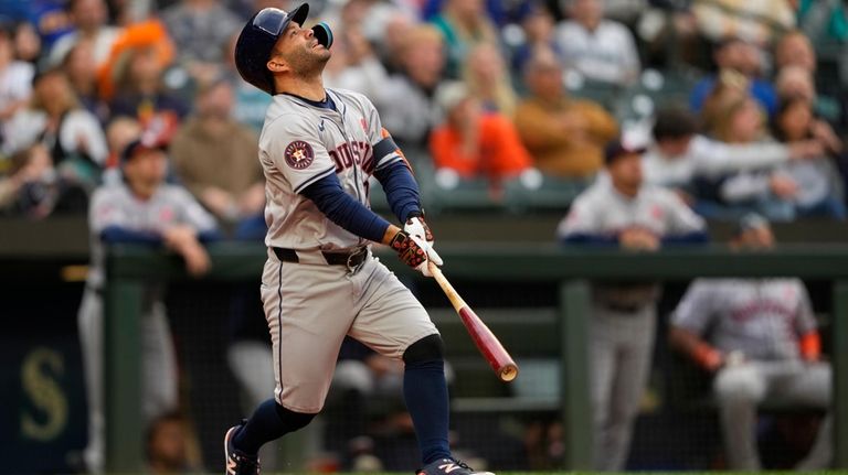 Houston Astros' Jose Altuve reacts after flying out to Seattle...