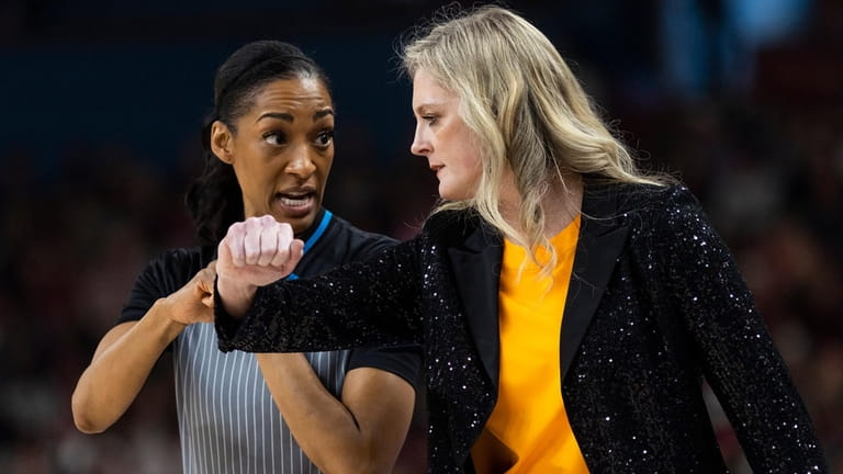 Tennessee coach Kellie Harper, right, talk with an official during...