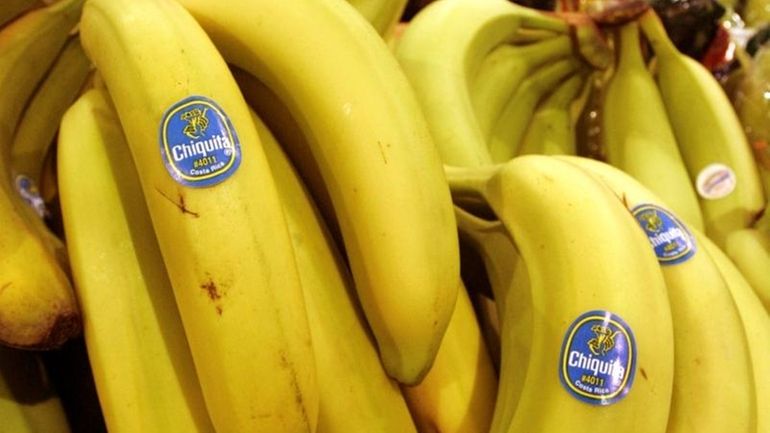 Chiquita bananas are on display at a grocery store in...