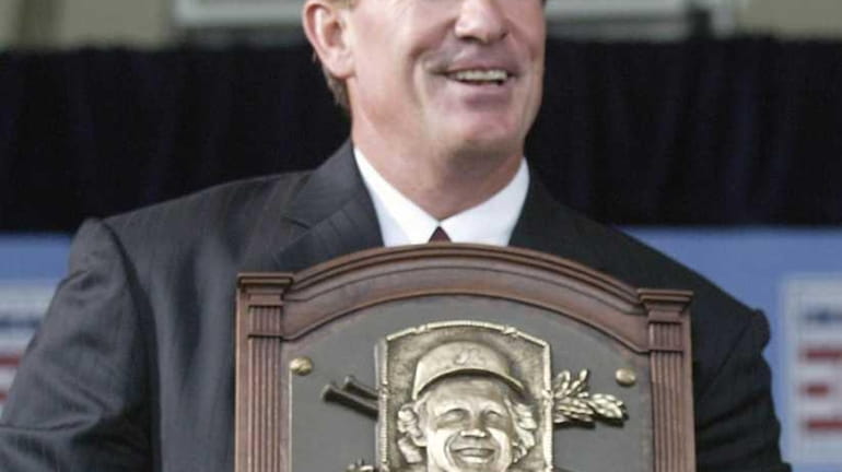 Gary Carter holds his Hall of Fame plaque during induction...