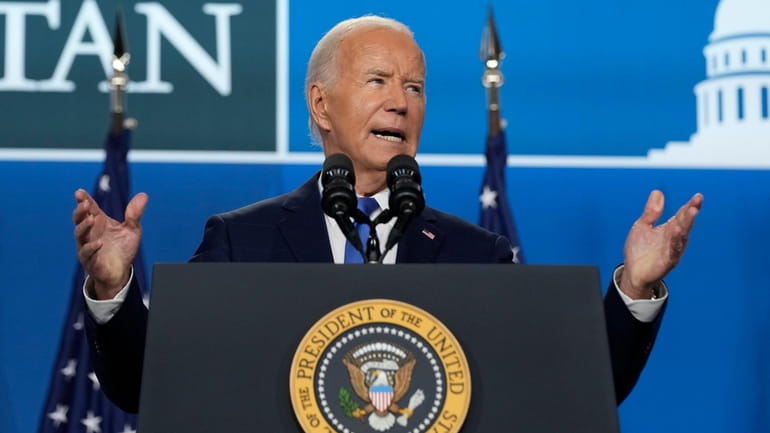 President Joe Biden speaks at a news conference following the...