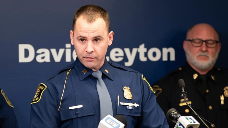 Michigan State Police Captain Greg Morenko speaks during a press...