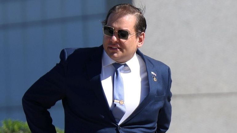 George Santos, arrives at federal court in Central Islip on...