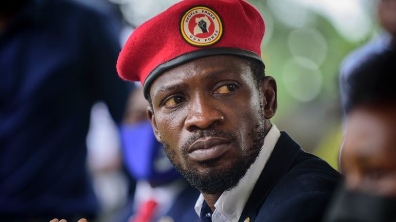 Opposition presidential challenger Bobi Wine, speaks to the media outside...