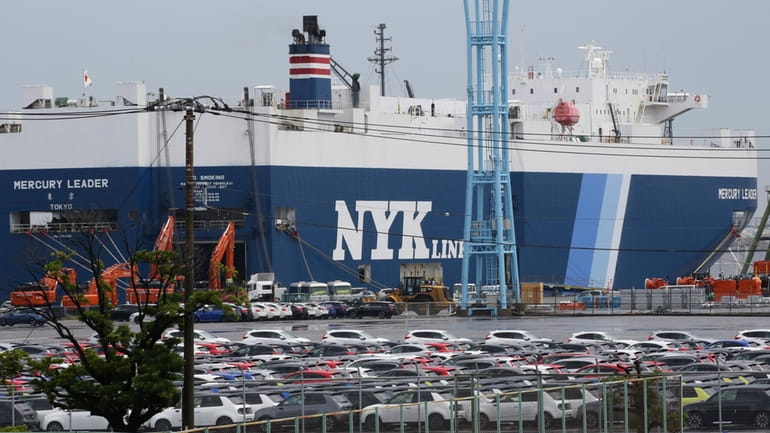 Cars for export park at a port in Yokohama, near...