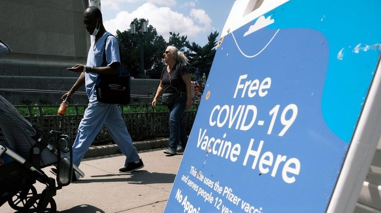 A New York City-operated mobile pharmacy advertises the COVID-19 vaccine...