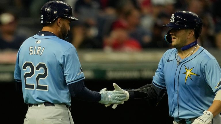 Tampa Bay Rays' Logan Driscoll, right, is congratulated by teammate...