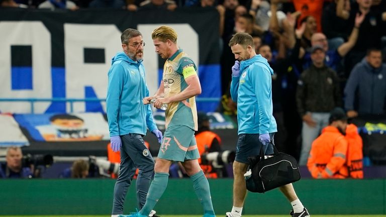 Manchester City's Kevin De Bruyne, center, gestures as he speaks...