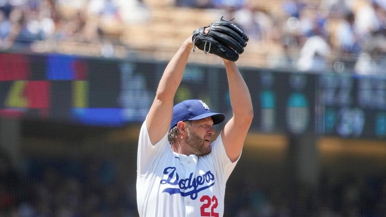 Los Angeles Dodgers starting pitcher Clayton Kershaw (22) winds up...