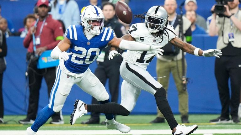 Indianapolis Colts safety Nick Cross (20) breaks up a pass...