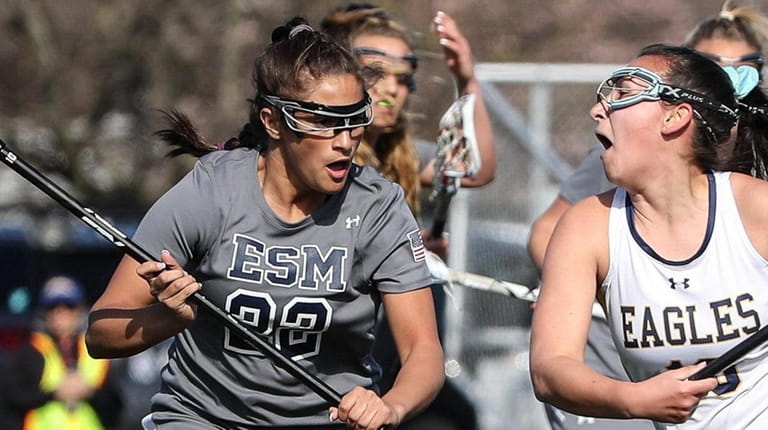 Eastport-South Manor's Alexandra Giacolone (left) defends during a Suffolk girls lacrosse...