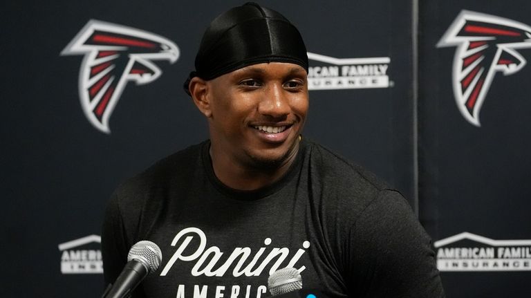 Atlanta Falcons quarterback Michael Penix Jr. (9) speaks during a...