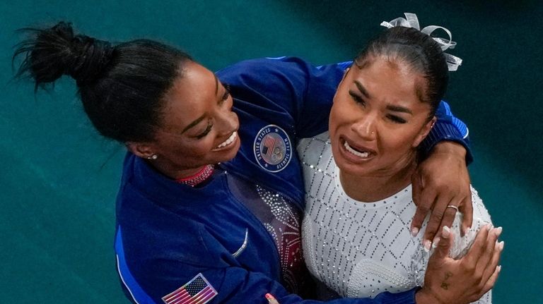 Jordan Chiles, of the United States, and Simone Biles, of...