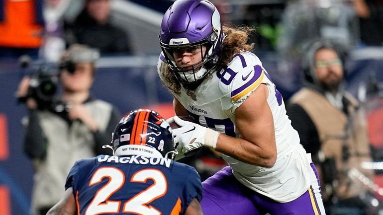 Minnesota Vikings tight end T.J. Hockenson (87) runs after the...