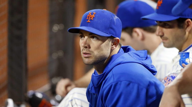 David Wright of the Mets looks on from the dugout...