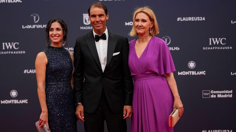 Spanish tennis player Rafael Nadal, center, Maria Francisca Perello, left,...