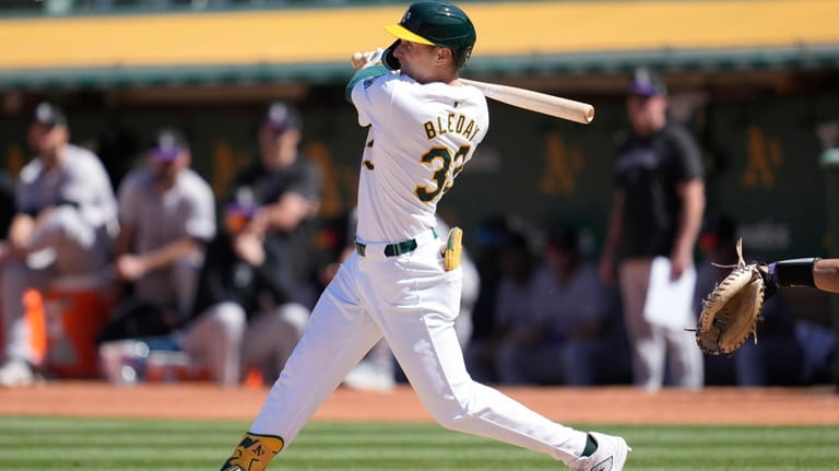 Oakland Athletics' JJ Bleday watches his two-run home run against...