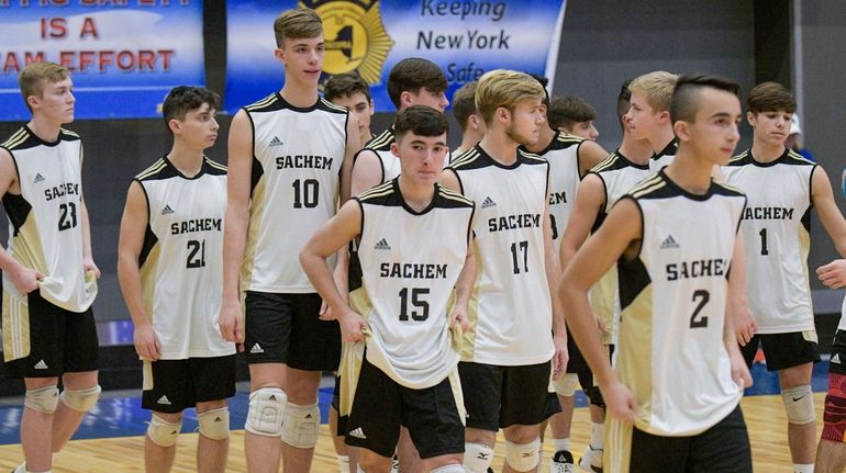 Sachem North players leave the court after losing to McQuaid...