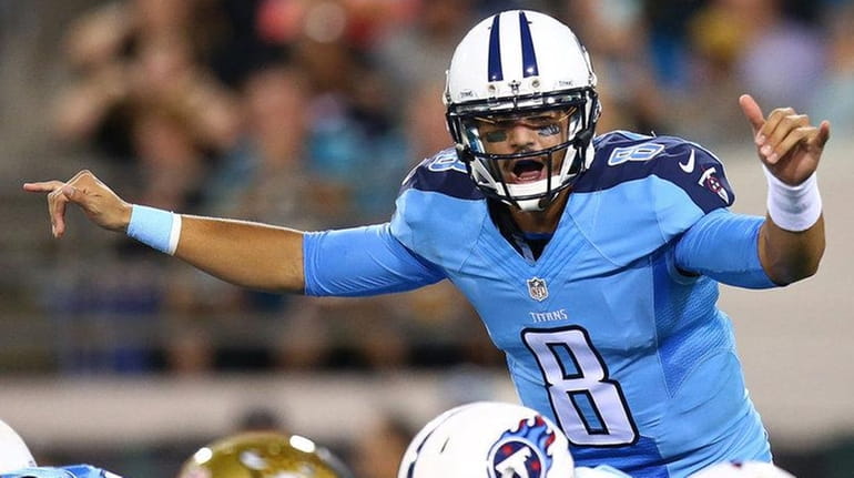 Marcus Mariota #8 of the Tennessee Titans calls a play...