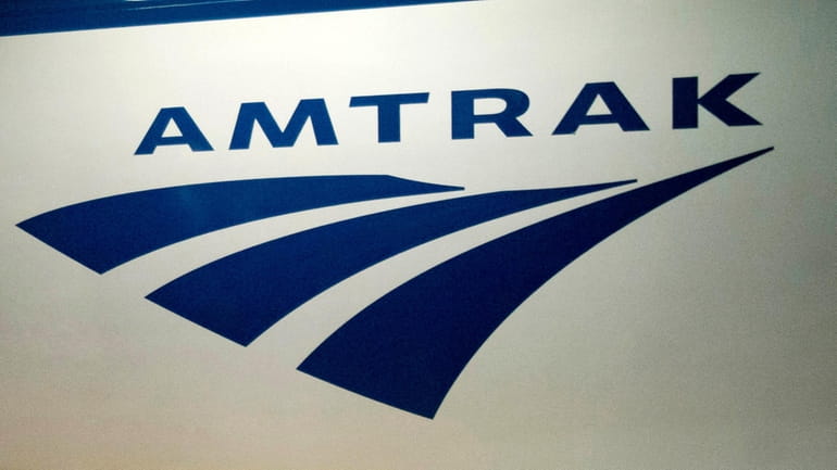In this Feb. 6, 2014 file photo, an Amtrak logo...