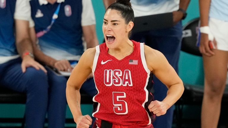 United States' Kelsey Plum (5) reacts after a three pointer...