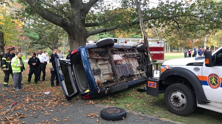 Nassau County police respond to an crash of an overturned...