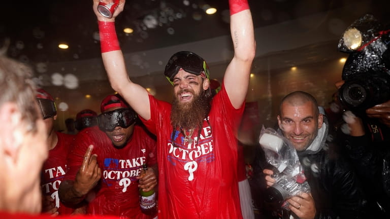 Philadelphia Phillies' Brandon Marsh celebrates after winning a baseball game...