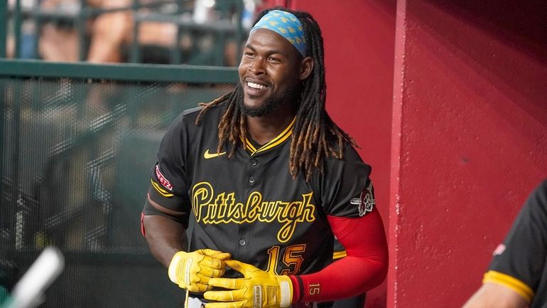 Pittsburgh Pirates' Oneil Cruz smiles in his dugout after hitting...