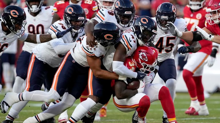 Kansas City Chiefs running back Deneric Prince (34) is stopped...