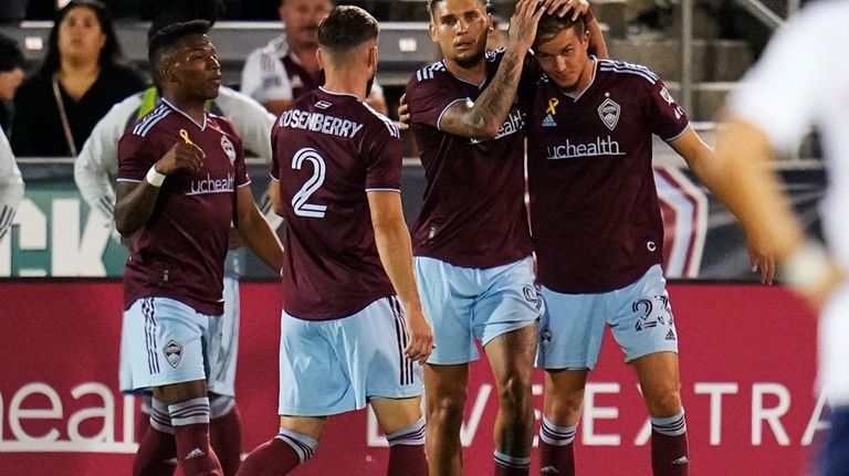 Colorado Rapids forward Rafael Navarro (9) congratulates midfielder Cole Bassett...