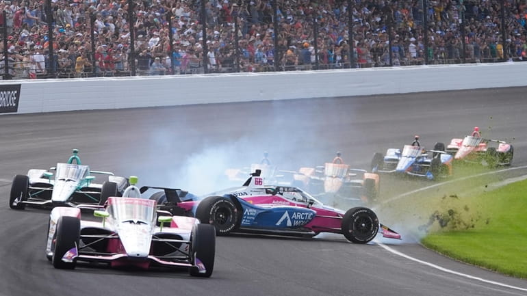 Tom Blomqvist (66), of England, wrecks during the Indianapolis 500...