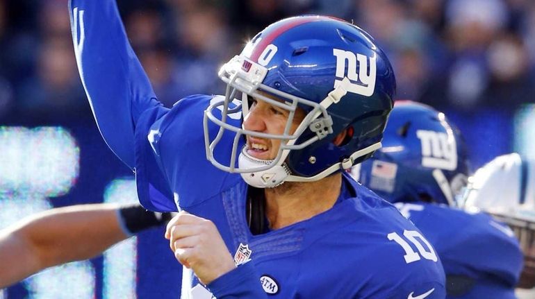 Eli Manning #10 of the New York Giants throws a...