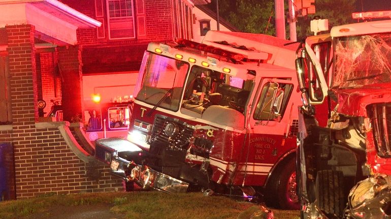 Firefighting vehicles are seen after a collision in Spring Garden...