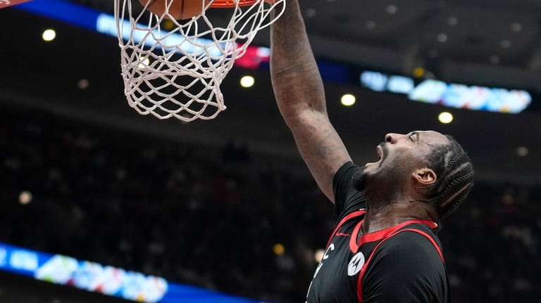 Chicago Bulls' Andre Drummond dunks against the Detroit Pistons during...