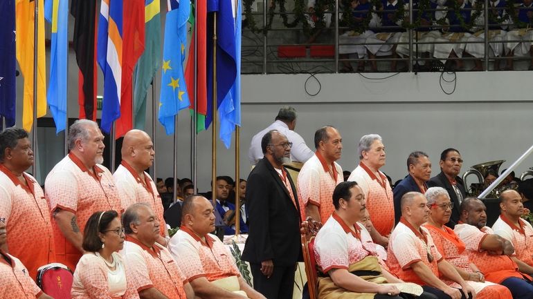 Leaders assemble for a photo at the opening of the...