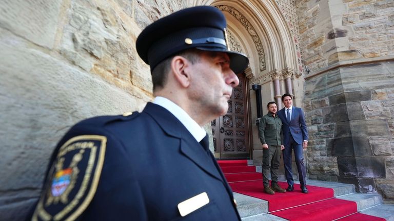 Prime Minister Justin Trudeau poses with Ukrainian President Volodymyr Zelenskyy...