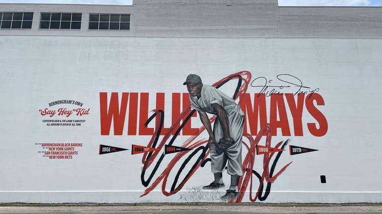 A Willie Mays mural is shown in downtown Birmingham, Ala.,...