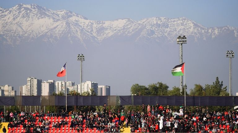 Club Palestino supporters watch a local league match against Santiago...